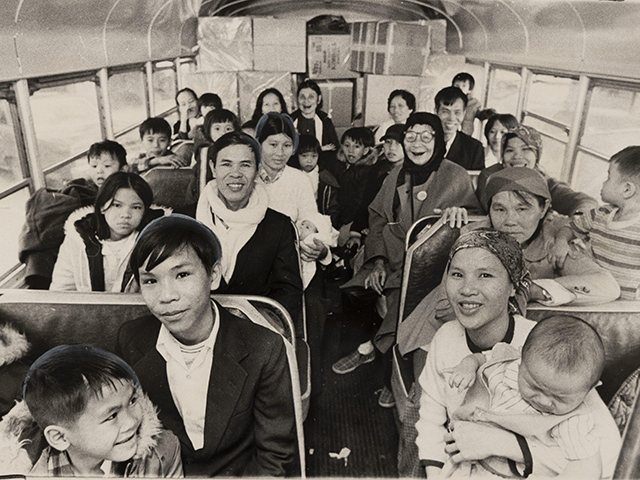 Photo of Vietnamese immigrants on a bus