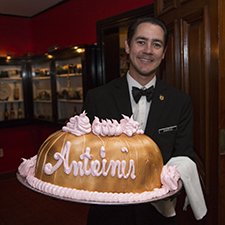 Antoine's waiter holding a baked Alaska